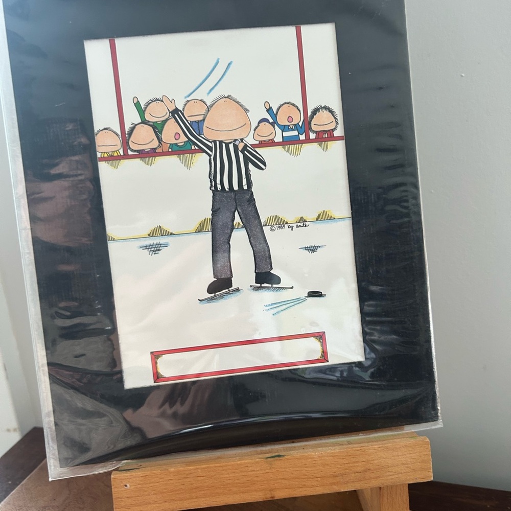 Hockey Referee “chuckies” Cartoon Artwork Print in Black matte Frame